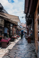 Fototapeta na wymiar Sarajevo, Bosnia and Herzegovina: coppersmith workshops seen walking in the Coppersmith Street within the heart of Bascarsija, old bazaar and historical and cultural center of the city