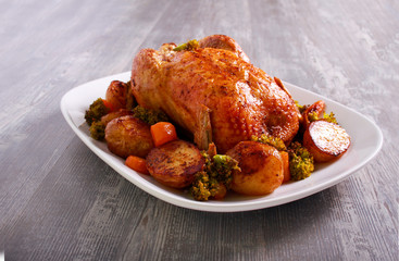 Roast chicken with potatoes and broccoli