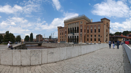 Sarajevo, Bosnia: skyline and view of Vijecnica, the former National library now Sarajevo City Hall, destroyed by Serbian grenades on 25 August 1992 in the siege of Sarajevo, reopened in 2014