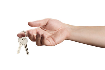 Hand holding keys, isolated on white background