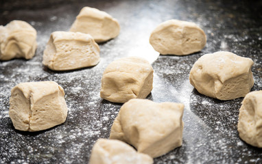 Preparing dough for pizza