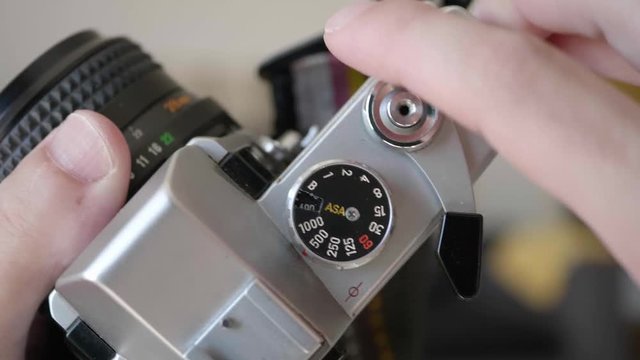Taking photos in analogical vintage camera. Top view