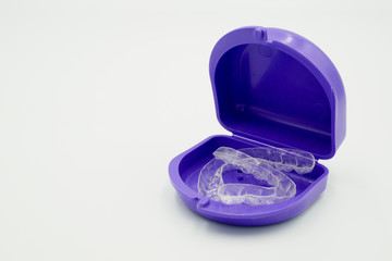 Clear plastic retainer teeth in the boxset, it's a new technology equipment for orthodontist give the patient to orthodontic surgery in dental clinic or hospital