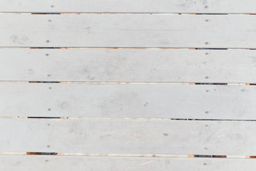 Obraz na płótnie Canvas horizontal white boards with nails. light textured background