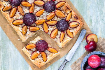 Plum and almond pastry dusted with icing sugar - top view