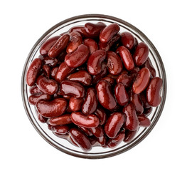 Canned red beans in a glass plate on a white. The form of the top.