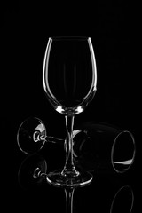 Empty wine glasses isolated on black background