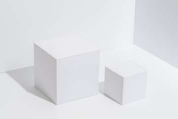 White cubical pedestals in the white corner
