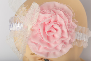 Head of child mannequin with bandage for girls on white background.