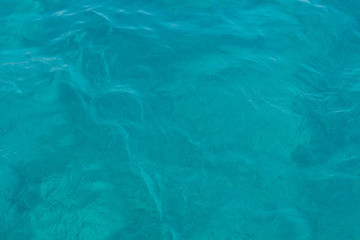 blue water background smooth surface with small waves