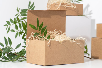 Disposable, recyclable paper boxes in the corner over white background