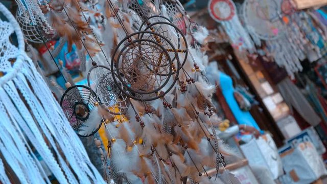 Indian traditional colorful, gentle Dream Catchers fluttering in the wind attracting tourists to buy in the city of Pushkar, India. Slow mo, slo mo, slow motion, high speed camera