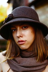 portrait of attractive young woman in old fashioned hat