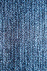 Close up of  blue denim jeans fabric texture background.