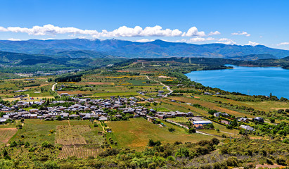 Fototapeta na wymiar High angle view of the village of Congosto and Barcena reservoir in Castile and Leon, Spain.