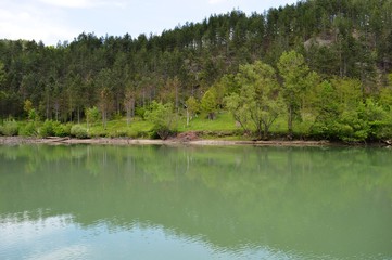 reflection of coastline in the lake