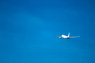  Flight to vacation airplane in the bright blue sky after takeoff