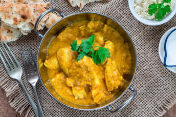 Chicken korma curry with naan bread - top view