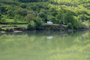 reflection of coastline in the lake