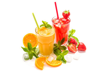 Fruit cocktail in glasses. Fruit drinks made of strawberry, orange, lime, lemon, decorated with mint