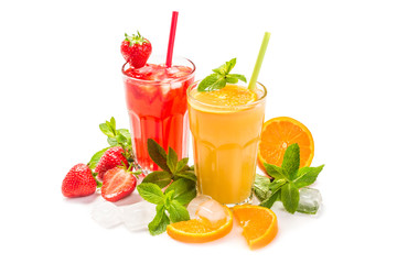 Fruit cocktail in glasses. Fruit drinks made of strawberry, orange, lime, lemon, decorated with mint