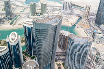 Aerial drone shot of skyscrapers and towers in the city - Abu Dhabi Al Reem island towers