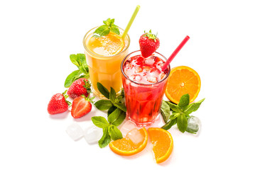 Fruit cocktail in glasses. Fruit drinks made of strawberry, orange, lime, lemon, decorated with mint