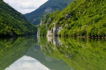 Fototapeta premium reflection of coastline in the lake