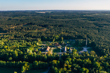 aerial view of the village surrounded by forest. 