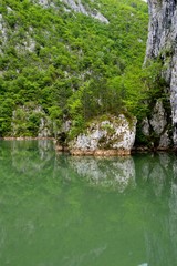 Reflection of the stone in the lake