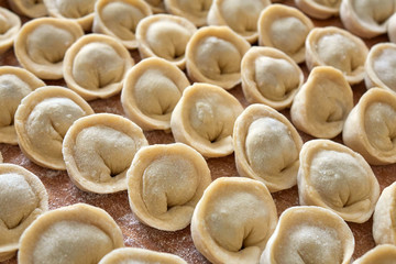 Homemade russian dumplings on the wooden board