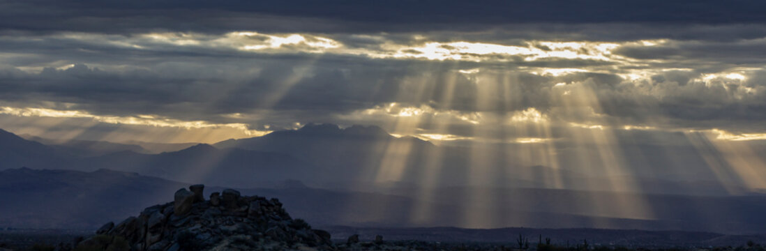 Dramatic Sun Rays Beaming Down On Mountains © Ray Redstone
