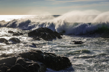 Rocks of Atlantic Ocean seen from beach in Porto, Portugal