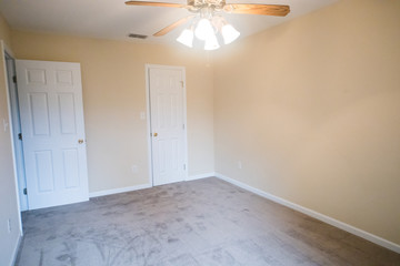 Empty Bedroom in Small House Apartment With Ceiling Fan