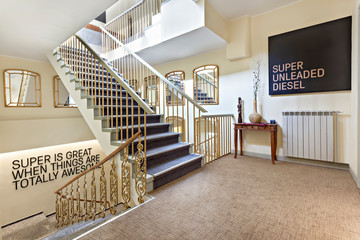 Staircase with gold rail in the modern hotel interior