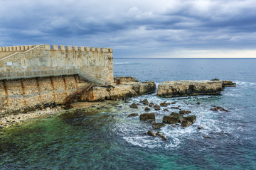 Walls of Ortygia isle on Ionian Sea, Syracuse city, Sicily Island in Italy