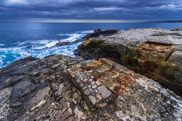 Rocks of Ionian Sea seen from Ortygia isle, Syracuse city, Sicily Island in Italy