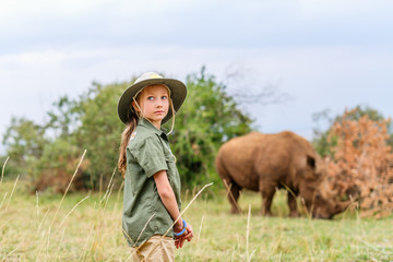Naklejka na ściany i meble Little girl on safari