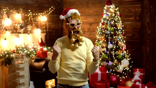 Solid Santa Claus man with beard and mustache. Hipster Santa Claus Christmas preparation. Christmas party. Portrait of surprised and funny man. Bearded crazy man looking at the camera.