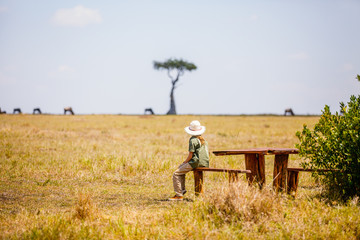 Little girl witnessing great migration in Kenya