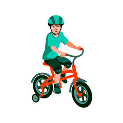 Fototapeta na wymiar Boy rides a tricycle