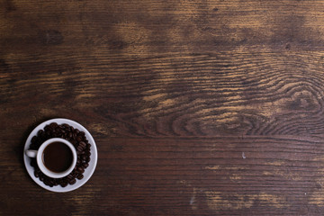 Top view of white espresso coffee cup with espresso coffee on white saucer