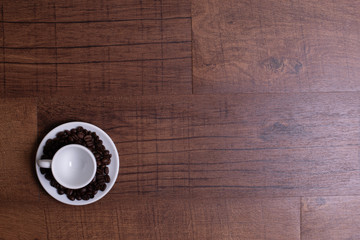 Top view of white espresso coffee cup on white saucer