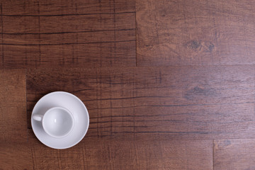 Top view of white espresso coffee cup on white saucer