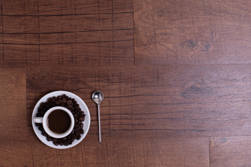 Top view of white espresso coffee cup with espresso coffee on white saucer