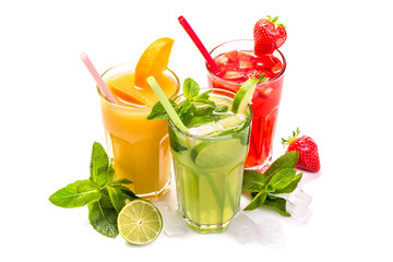 Fruit cocktail in glasses. Fruit drinks made of strawberry, orange, lime, lemon, decorated with mint