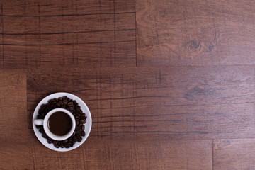 Top view of white espresso coffee cup with espresso coffee on white saucer