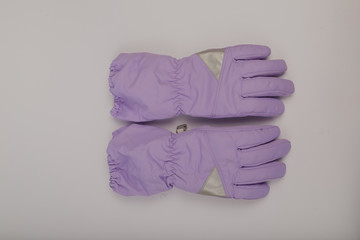 Children's winter gloves on a white background.