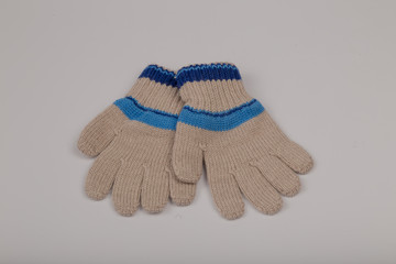 Children's winter gloves on a white background.