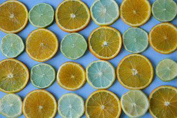 Flat lay. Top view. Colorful citrus fruits slices seamless pattern. Texture, background. Slices of...